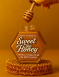 Honey jar with 'Sweet Like Honey' text and a honey dipper on an orange background